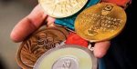 Историю олимпийских медалей